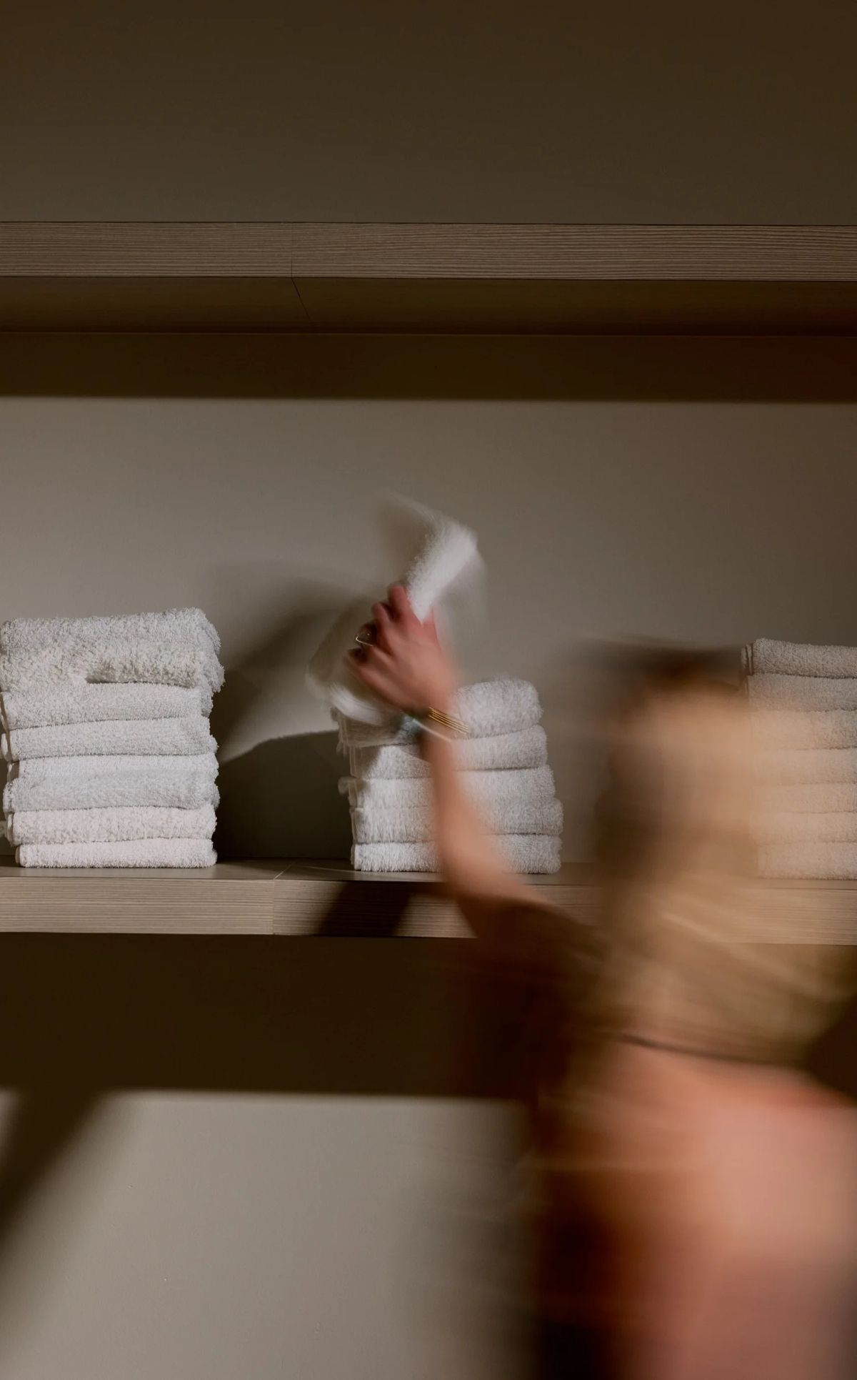 Warm-toned motion blur of folded towels in service — the hospitality of the room